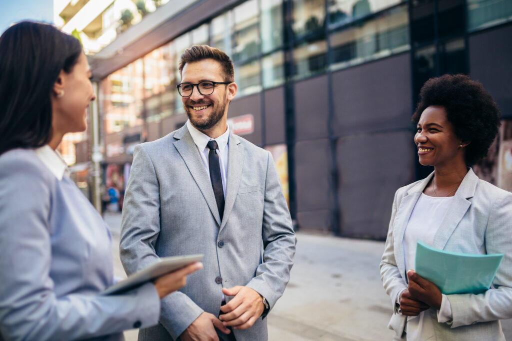 a man in a suit and tie talking to a woman