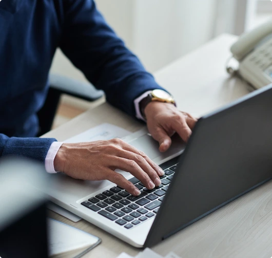 high-angle-view-cropped-employee-work-with-laptop